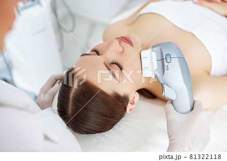 Woman getting facial lifting therapy in beauty salon Woman getting facial lifting therapy in beauty salon 81322118