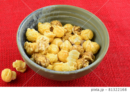Taiwanese bubble tea caramel popcorn in bowl on red background Taiwanese bubble tea caramel popcorn in bowl on red background 81322168