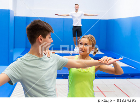 Teenager preparing to trampoline training Teenager preparing to trampoline training 81324295
