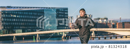 Winter running man cold weather sport clothing active athlete city urban living jogging outside on Europe street banner panoramic background. Copenhagen, Denmark Winter running man cold weather sport clothing active athlete city urban living jogging outside on Europe street banner panoramic background. Copenhagen, Denmark 81324318