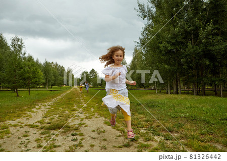 Girl running on path in countryside in nature Girl running on path in countryside in nature 81326442