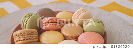 Macaroons dessert plate panoramic banner. Pastel colors macarons selection at home 81326520