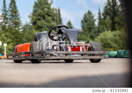 A go-karting car is standing on the highway and waiting for the driver. Go-karting cars for children and adults. 81330991