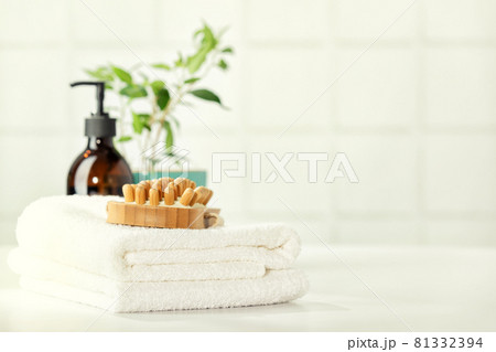 SPA and Bathroom accessories on white bathroom countertop against tile wall 81332394