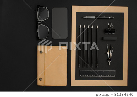 Office desktop with various black objects on background Office desktop with various black objects on background 81334240