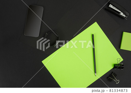 Top view of office supplies on blackboard background with copy space. Top view of office supplies on blackboard background with copy space. 81334873