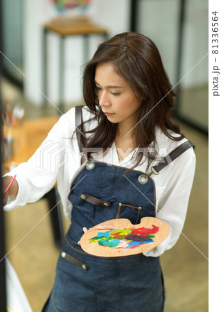 Portrait of female painter, painting art piece with oil colour Portrait of female painter, painting art piece with oil colour 81336564