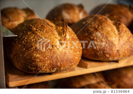 Fresh artisan bread. Loaves of delicious wholesome natural hot bread. Healthy food production and proper nutrition concept 81336964