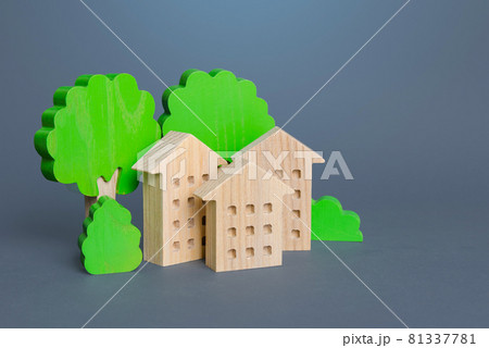 Residential buildings among the trees. Environmentally friendly, energy efficiency, zero carbon emissions. Carbon neutrality. Buying and selling real estate. Renting housing, realtor services. Residential buildings among the trees. Environmentally friendly, energy efficiency, zero carbon emissions. Carbon neutrality. Buying and selling real estate. Renting housing, realtor services. 81337781
