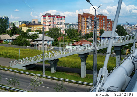Staircase with non-concrete supports to the pedestrian bridge over the highway. 81342792