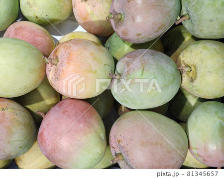 Bunch Of asian freshness organic sweet rare Mangoes on department store shelf, advertising backgrounds 81345657