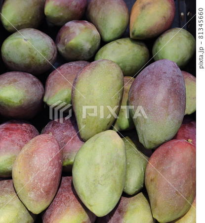 Bunch Of asian freshness organic sweet rare Mangoes on department store shelf, advertising backgrounds 81345660