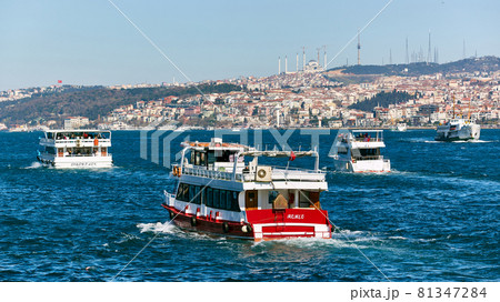 Istanbul, Turkey - 1 April, 2017: Passenger ships crossing Bosporus at spring day Istanbul, Turkey - 1 April, 2017: Passenger ships crossing Bosporus at spring day 81347284