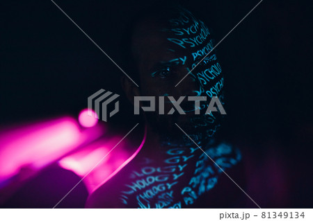 Young adult man with word Psychology on his face in the dark. 81349134
