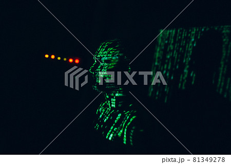 Young man with geen abstract letters on his face in the dark. Young man with geen abstract letters on his face in the dark. 81349278