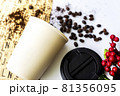 Cream colored plastic coffee cup and coffee beans 81356095
