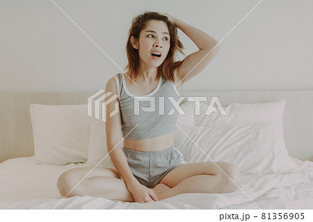 Attractive woman relax after wake up in bedroom. Summer vacation. 81356905