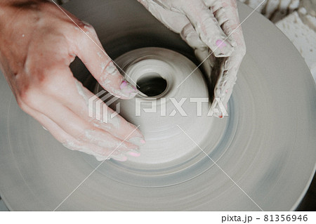 Top view of clay products, on a pottery wheel with copy space Top view of clay products, on a pottery wheel with copy space 81356946