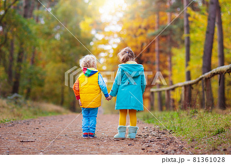 Kids play in autumn park. Children in fall. Kids play in autumn park. Children in fall. 81361028