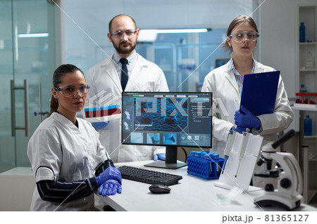 Portrait of medical scientist team working in microbiology hospital laboratory 81365127