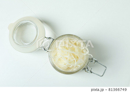 Glass jar of sauerkraut on white background Glass jar of sauerkraut on white background 81366749