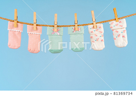 Baby socks on a clothesline. Baby clothes washing Baby socks on a clothesline. Baby clothes washing 81369734