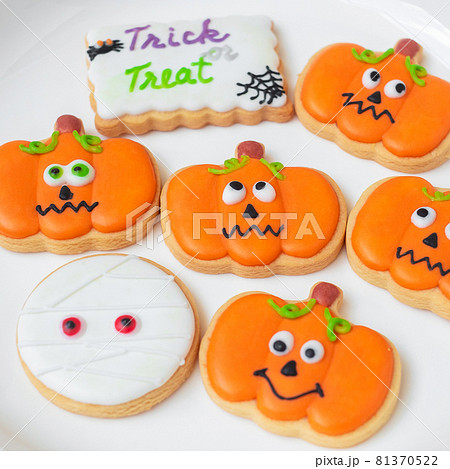 Happy Halloween day with funny Cookies, different Pumpkin biscuits on plate. Trick or Threat, Hello October, fall autumn, Traditional, party and holiday concept Happy Halloween day with funny Cookies, different Pumpkin biscuits on plate. Trick or Threat, Hello October, fall autumn, Traditional, party and holiday concept 81370522