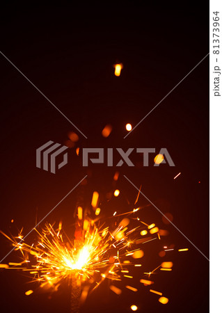 Christmas sparkler in haze with red light 81373964