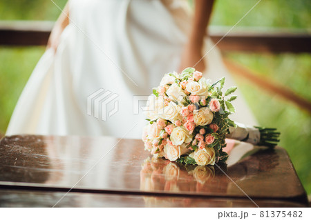 bouquet of roses, bride dress background bouquet of roses, bride dress background 81375482