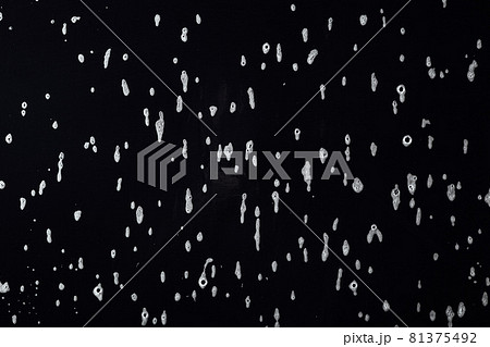 soap foam stains on black background 81375492