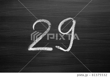 number twenty nine enumeration written with a chalk on the blackboard 81375532