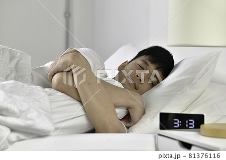 Handsome Young Asian man sleeping in bed Handsome Young Asian man sleeping in bed 81376116