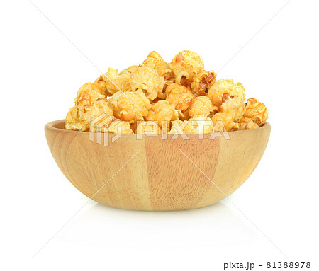 Popcorn in wooden bowl isolated on white background 81388978