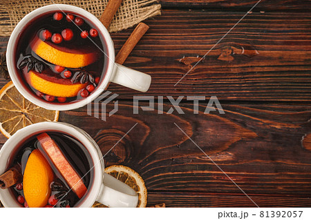 Christmas composition with hot mulled wine in rustic cup Christmas composition with hot mulled wine in rustic cup 81392057