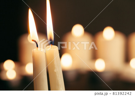 Candle flame close up on a black background Candle flame close up on a black background 81392242