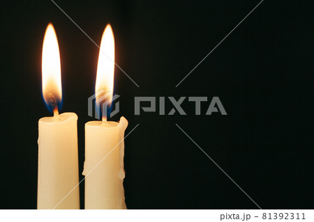 Candle flame close up on a black background Candle flame close up on a black background 81392311