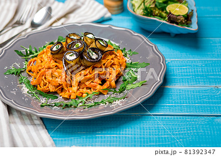 Pasta with eggplants, tomato, cheese and arugula Pasta with eggplants, tomato, cheese and arugula 81392347