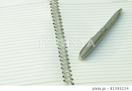 Close up of pen placed on spiral notebook. Full frame shot. High angle view. Business education background. 81393224