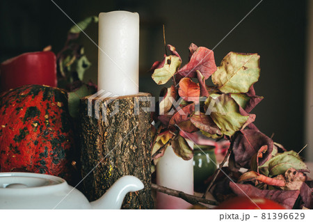 Autumn decor with pumpkin, candles and tableware Autumn decor with pumpkin, candles and tableware 81396629