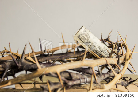 A money with thorn crown over the light wall. 81399150