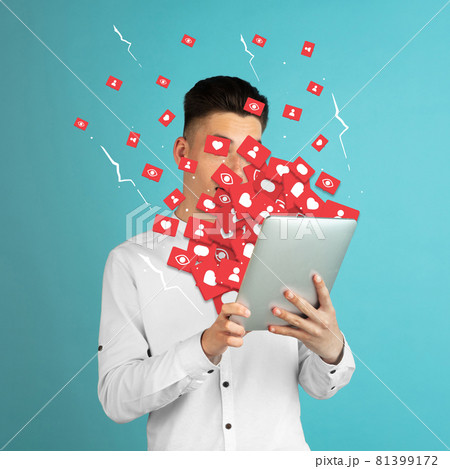 Addiction to social media. Young man attacked by notifications Addiction to social media. Young man attacked by notifications 81399172