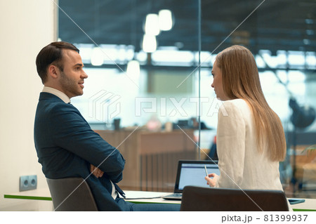 Interviewing employee beautiful girl. Close-up of two business people sitting in the workplace with documents on the table. Successful interview with a supervisor and employee 81399937