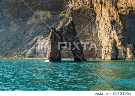 The Republic of Crimea. July 21, 2021. A picturesque view in sunny weather of the Golden Gate rock at the foot of the Kara-Dag mountain near the city of Koktebel. 81401955