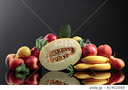 Fresh fruits on a black reflective background. 81402080