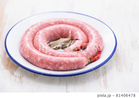 typical spanish sausage on white dish on wooden background 81406478