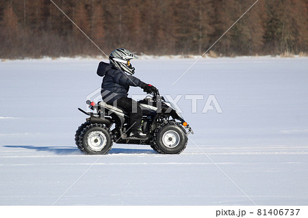 Driving a Quad in Winter 81406737