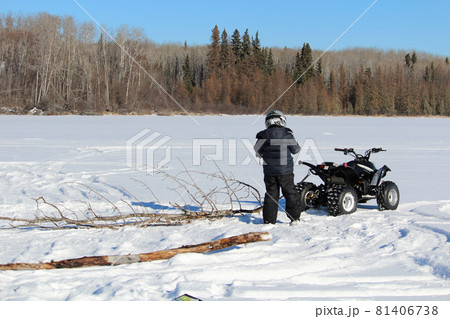 Pulling Firewood With a Quad to Make a Fire on the Ice 81406738