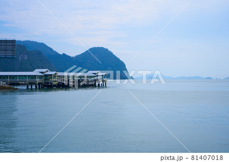 Covered boat pier. Transport boat port on a tropical island 81407018