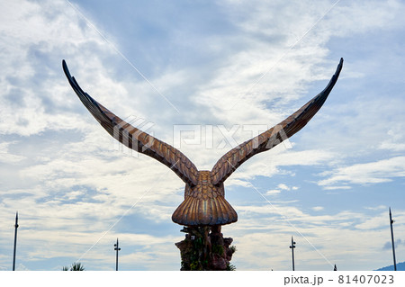 A sculpture of a red eagle spreading its wings. Popular tourist spot on Langkawi island 81407023
