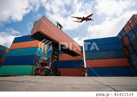 Cargo container for overseas shipping in shipyard with airplane in the sky . 81421514